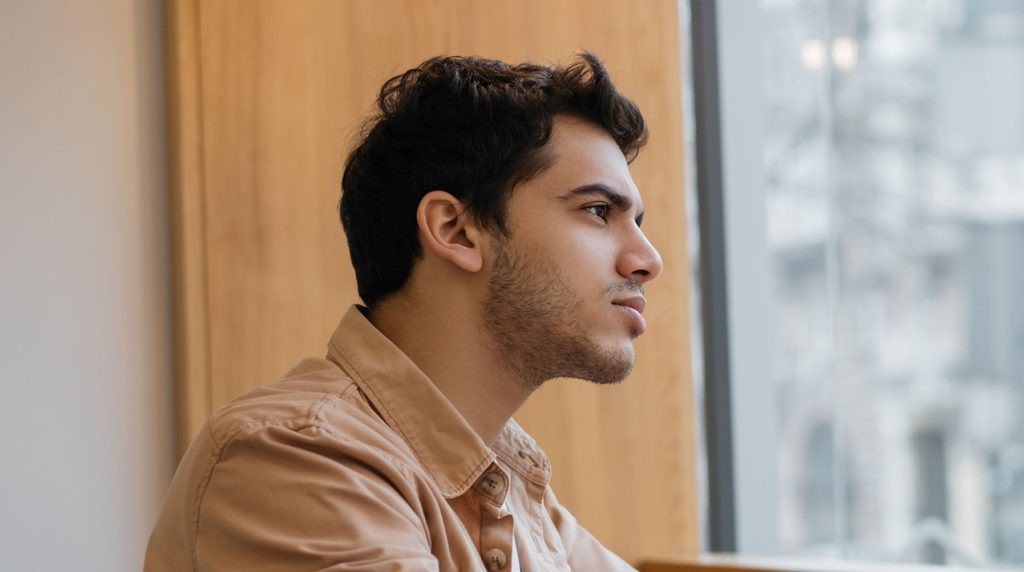 Young man in Aurora, IL contemplates his girlfriend's decision to get an abortion